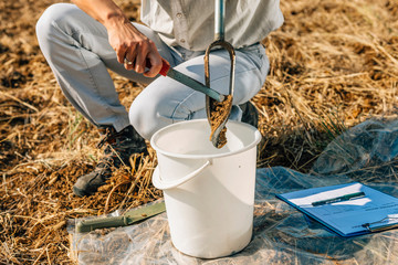 Soil Sampling. Woman Agronomist Taking Sample With Soil Probe Sampler