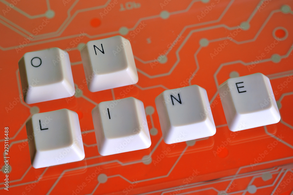 Poster keyboard keys form the word on line on orange electric circuit in the background