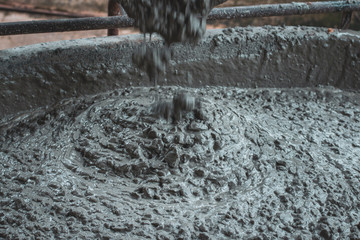 Concrete poured from a concrete mixer The perfect combination of expert technicians in road and...