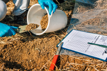 Soil Testing. Agronomy Inspector Taking Soil Sample