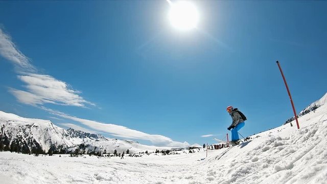 Skier jumping on a kicker in slow motion