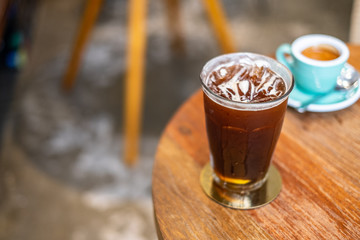 Ice coffee and espresso on wooden table