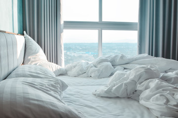 Comfortable bedroom,messy bedding sheets and duvet with wrinkle messy in the bedroom
