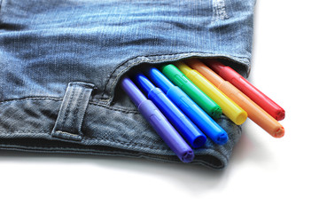 Markers in pocket. Markers in jeans pocket on white background