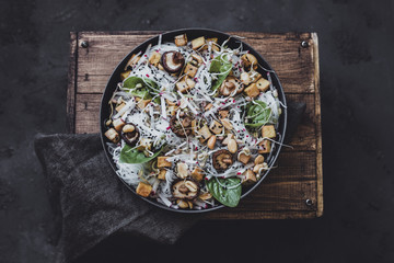 Healthy asian salad. Rice noodles with shiitake mushrooms and fried tofu.
