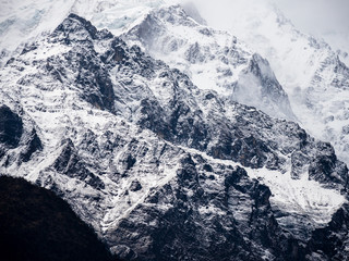 Himalayan Mountains in Fog, Full Frame of Snowy Mountain Ridges and Exposed Rock