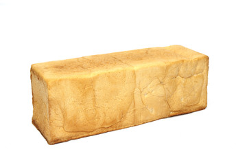 square loaf of bread is isolated on a white background.