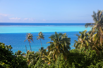 View of the layers of blue in the ocean from an island in Tahiti. 