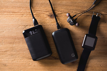 black power bank over wooden desk