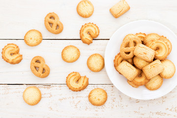 Butter cookies in dish on rural table