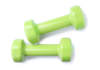 Color dumbbells on white background. Home fitness