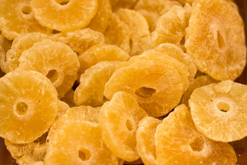 canned pineapple circles peaces food background in supermarket counter 