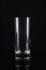 New empty tall glass on black background