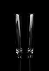 New empty tall glass on black background