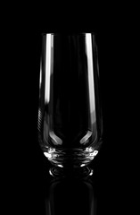 New empty tall glass on black background