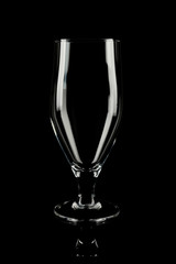 Clean empty cocktail glass on black background