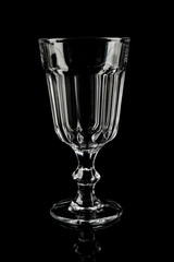 Clean empty cocktail glass on black background