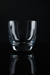New clean empty glass on black background
