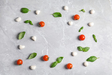Flat lay composition with ingredients for pizza on light table, space for text