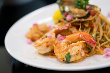 Spaghetti with seafood. Selective focus shrimp