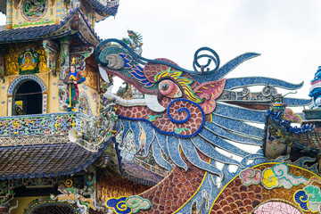Naklejka premium Colorful mosaic of porcelain in shape of dragon in pagoda in Vietnam