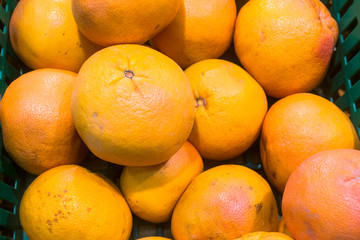 delicious juicy oranges on the supermarket counter