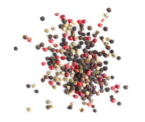Heap of mixed peppercorns isolated on white, top view