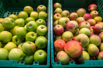 delicious juicy apples on the supermarket counter