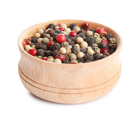 Bowl of mixed peppercorns isolated on white