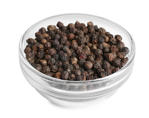 Bowl of black peppercorns isolated on white