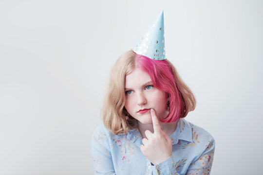 Sad Teenager Girl In Birthday Hat