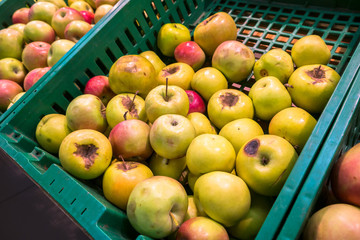 delicious juicy apples on the supermarket counter