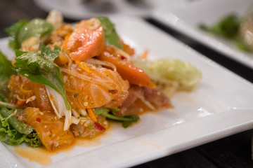 Spicy salmon salad Thai food style.