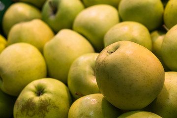 delicious juicy apples on the supermarket counter