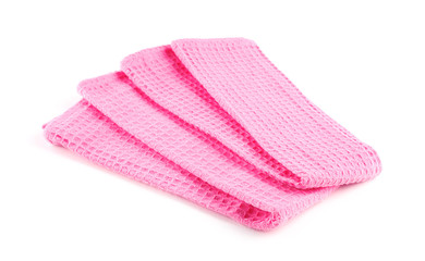 Folded pink kitchen towels on white background