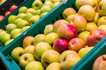 delicious juicy apples on the supermarket counter