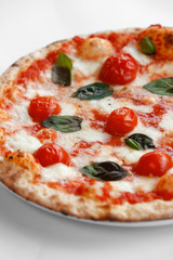 Margherita Pizza is a typical pizza from Naples, made with tomatoes, cheese,fresh basil, salt and olive oil. Traditionally, it is made with fior di latte rather than buffalo mozzarella. 