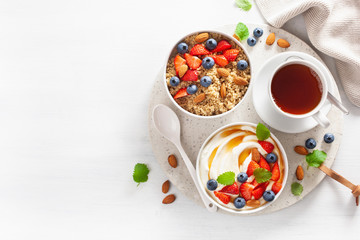 Obraz na płótnie Canvas yogurt with strawberry blueberry honey almond and quinoa for breakfast