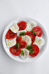 Caprese, or Caprese Salad (Insalata Caprese) is a famous and traditional Italian entrée or Anti pasto. A Caprese salad is made from fresh tomato, buffalo mozzarella, basil, olive oil, salt and pepper
