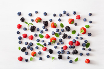 assorted berries over white background. blueberry, strawberry, raspberry, blackberry