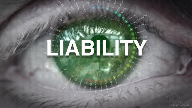 Close up of an eye focusing on a Liability concept on a futuristic screen.