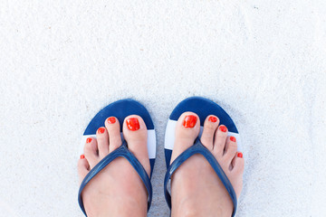 Female feet on sand