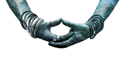 woman hand in yoga symbolic gesture mudra wearing lot of bracelets and rings double exposure