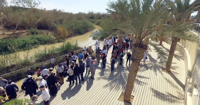 People go through the Ritual of baptism and bathing in the Jordan River At the site of the baptism of Jesus of Nazareth.