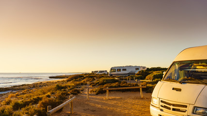Camper cars on beach sea shore