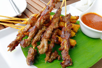 Satay chicken beef with peanut sauce onion ketupat rice cake