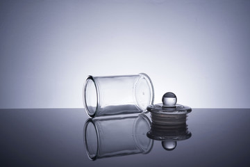 An empty glass container on white background