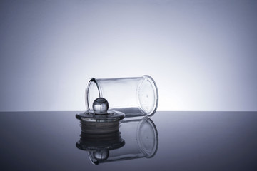 An empty glass container on white background