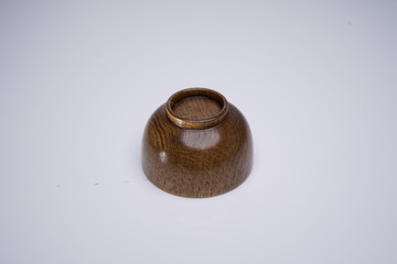 a wooden bowl on wooden background