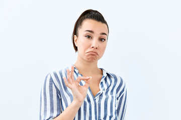 Sarcasm emotion Brunette girl  portrait against white background
